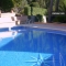 Con una bonita piscina comunitaria